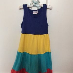 Play dress has a minor detergent mark.